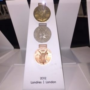 A display showing 3 of the medals from the London 2012 Olympics