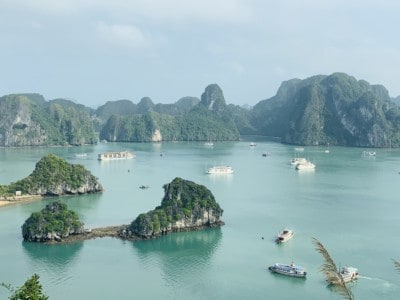 A view over part of Vietnam's Hal Long Bay.  You can see the limestone islands in the water and cruise ships floating between them