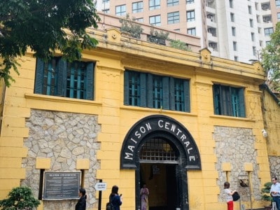 The Maison Centrale or Hao Lo Prison in Hanoi.  This is a yellow building with the name Maison Centrale in an arch above the front door.