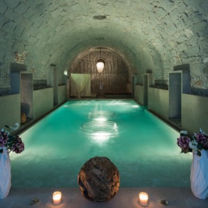 The main pool in the Roman-Irish spa - there is an arched roof and low level lighting