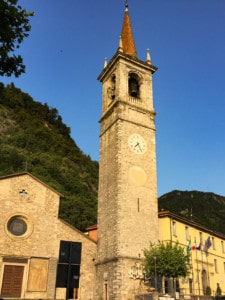 A picture of the small church at the top of the piazza in Varenna. You can see the tower here with the blue sky in the background.