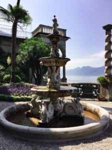 One of the ornate statues in Villa Monastero. You can see the building and lake in the background