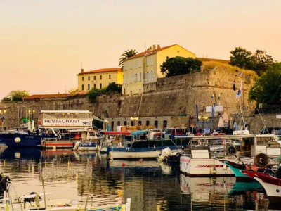 A view of the harbour in the capital of Corsica, Ajaccio.  You can see the harbour wall and boats in the water