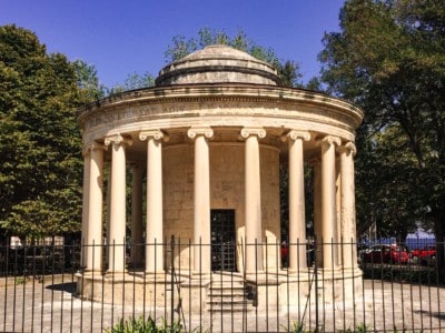The Maitland Rotunda.  This is a small stone structure with Roman type columns around it.  There are trees to the side.
