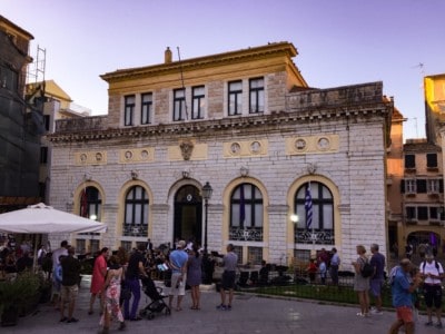 A building in the old town with people outside.