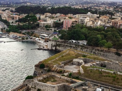 A view from the top of the Old Fort.  You can see the base of the fort, the sea and the buildings of Corfu Town in the background.