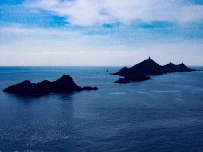 The Sanguinaires archipelago in the sea.  You can see the small islands in silhouette in the sea