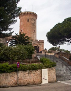 Palma's Castell de Belver.  You can see a circular tower here with steps leading up to it and trees surrounding it.