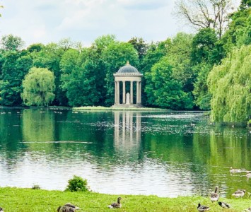 A small monopteros by a lake in the grounds of Nymphenburg Palace