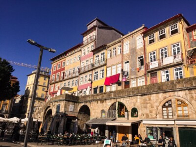 The colourful houses of Porto's Ribeira, the vibrant area alongside the river.  You can see some of the outdoor restaurants at the base of the buildings.
