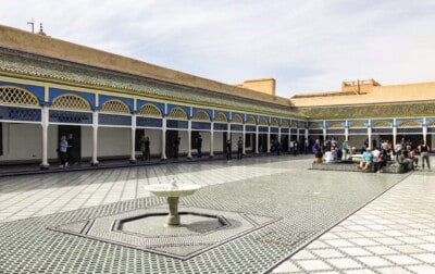 A view of the large courtyard showing how large this is.  There is a small fountain in the foreground